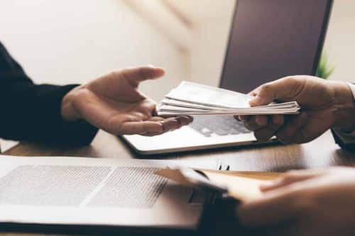 Executor, personal representative of an estate, handing over payment to creditors.