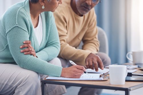 Senior couple, documents and sign contract - estate planning attorney concept